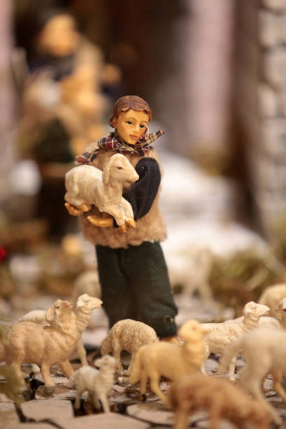 Shepherd Carrying A Lamb In His Arms Christmas Crib Stock Photo
