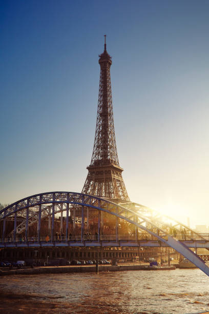 istock Eiffel tower at sunset over the river Seine 1185630784