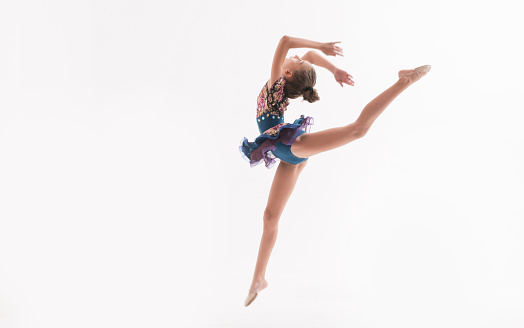 Female ballerina performing a jump