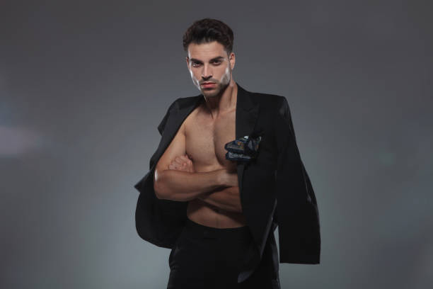 istock cool fashion model holding jacket on shoulders 1185637892