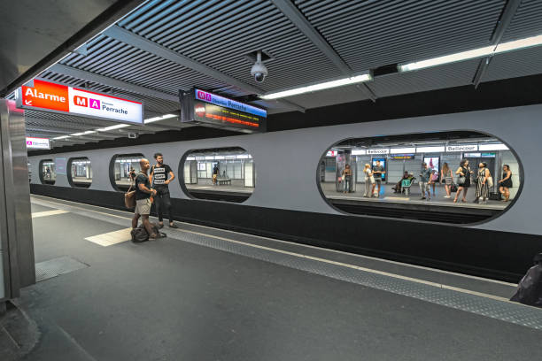 Passengers waiting for a train in a Metro Station in Lyon 23 July 2019, Lyon, France: Passengers waiting for a train in a Metro Station in Lyon st jean saint barthelemy stock pictures, royalty-free photos & images