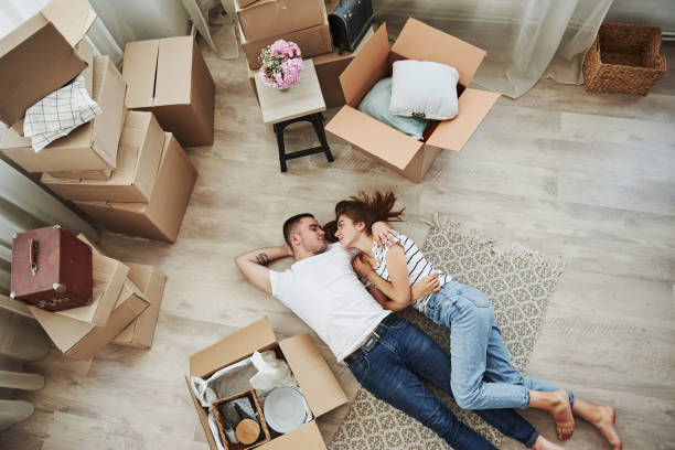 istock Taking a rest. Lying down on the floor. Cheerful young couple in their new apartment. Conception of moving 1185641196