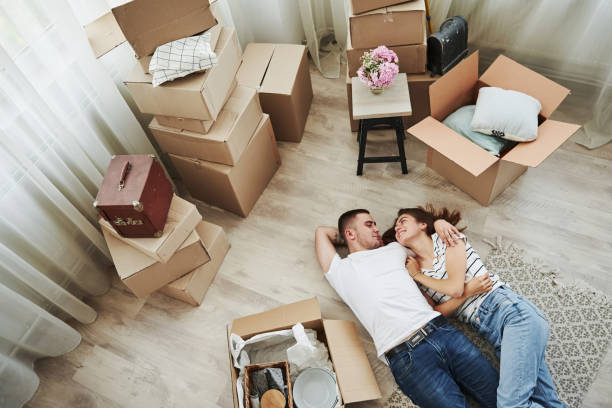 istock Taking a rest. Lying down on the floor. Cheerful young couple in their new apartment. Conception of moving 1185641612