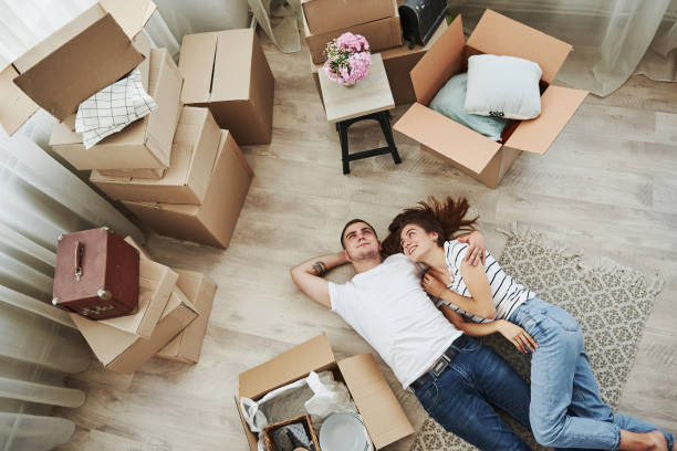 istock Taking a rest. Lying down on the floor. Cheerful young couple in their new apartment. Conception of moving 1185641920