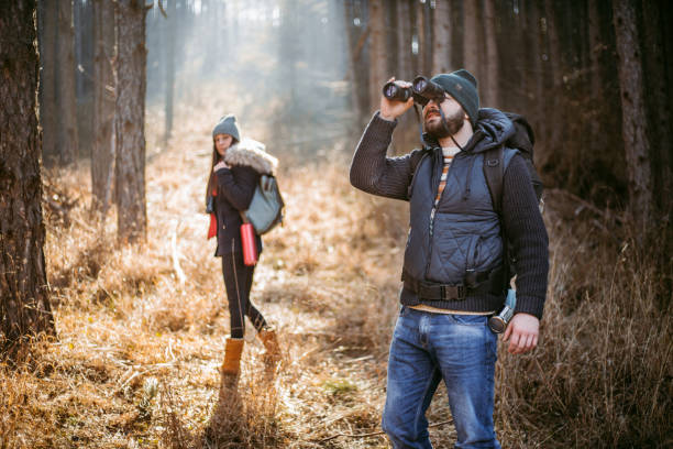 istock Young couple enjoying beautiful autumn forest in the mountains 1185641970
