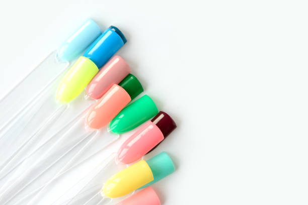 istock Nail polish samples in different bright colors. Colorful nail lacquer manicure swatches. Top view of nail art samples palette. Free copy space. 1185642730