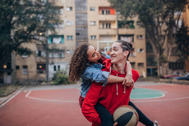 istock Couple on streetball court 1185642783