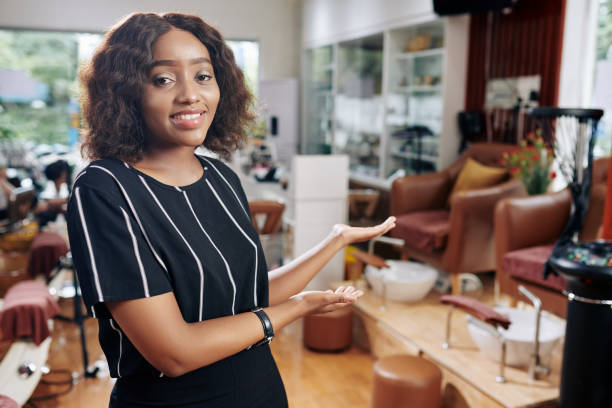 istock Hairdresser welcoming clients 1185642934