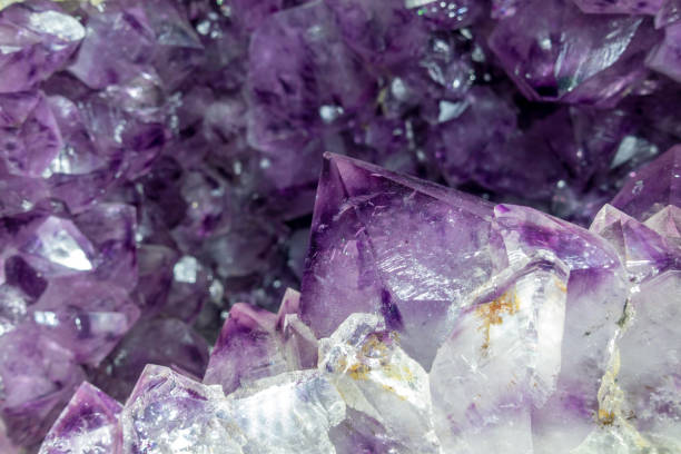 istock Close-up of raw Amethyst druse .Gemstone - detail 1185644436