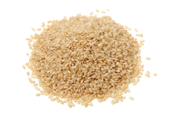 riso integrale - brown rice rice brown scoop foto e immagini stock