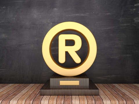 Trophy with Trademark on Wood Floor - Chalkboard Background - 3D Rendering