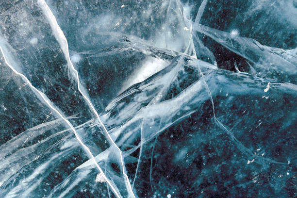 istock Cacks in thick solid layer of ice of a frozen lake Baikal 1185646278