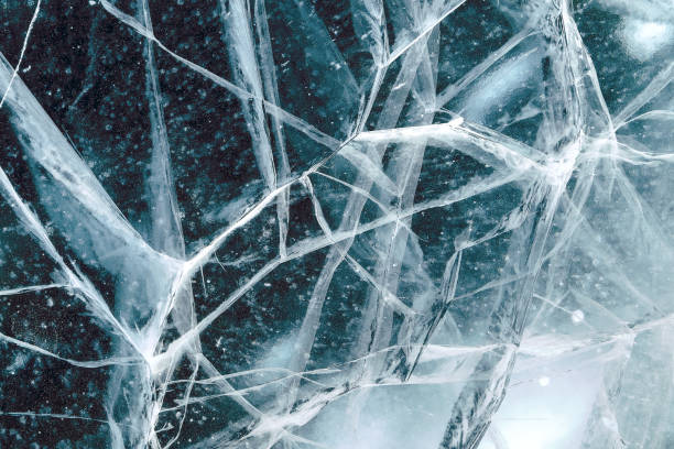 istock Cacks in thick solid layer of ice of a frozen lake Baikal 1185646280