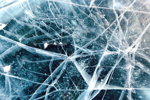 istock Cacks in thick solid layer of ice of a frozen lake Baikal 1185646281