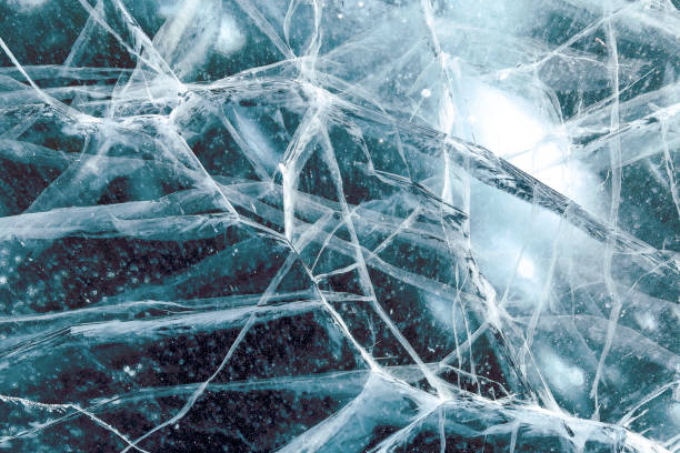 istock Cacks in thick solid layer of ice of a frozen lake Baikal 1185646284