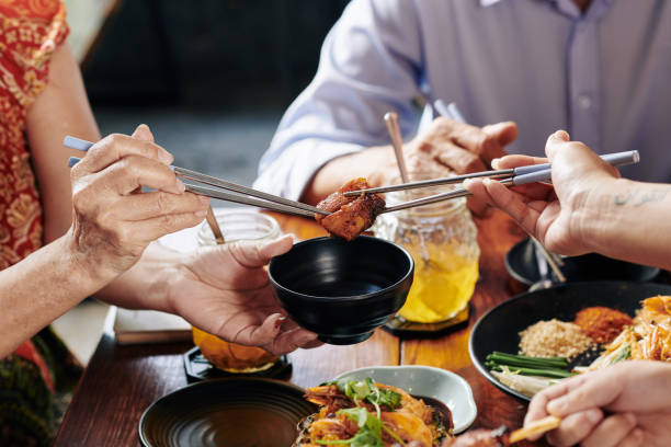 istock Dipping chicken piece in sauce 1185646751