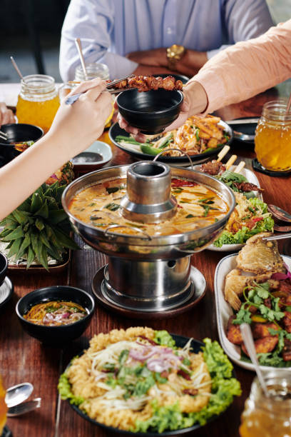 istock People eating delicious Asian food 1185646773