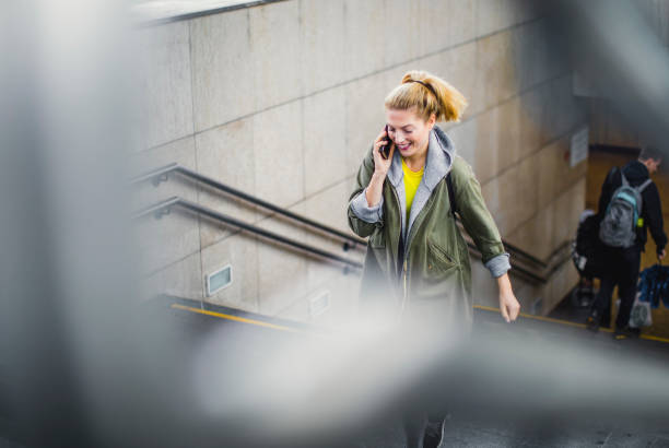 istock Young Woman Moving up The Stairs at Train Station 1185647822