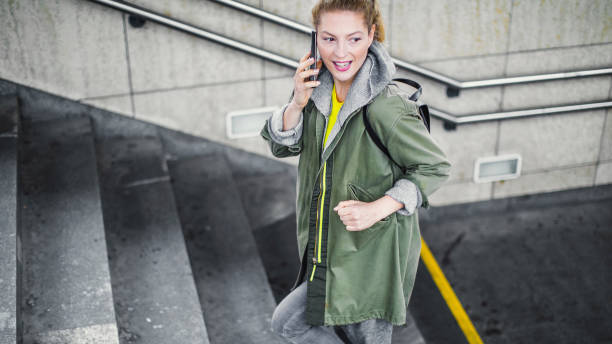 istock Young Woman Moving up The Stairs at Train Station 1185648856