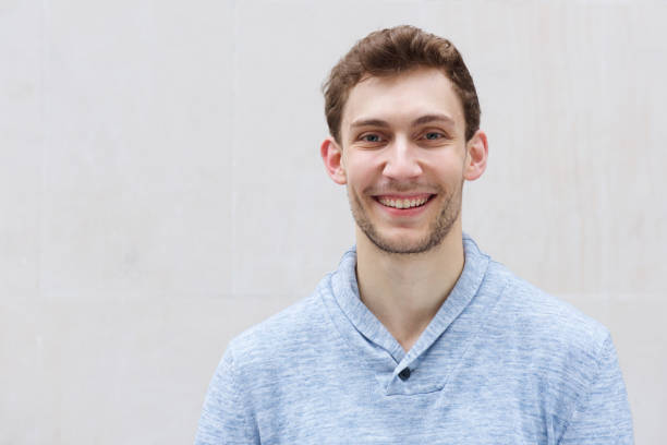 istock front portrait of handsome young man smiling and looking at camera 1185650737