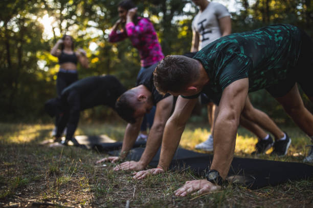 istock Group of athletes exercising outdoors 1185652813