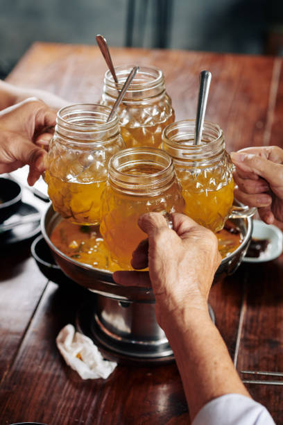 istock Friends clinking mugs with ale 1185660392