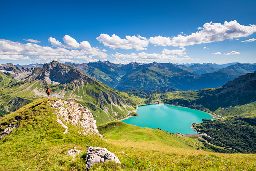 Awesome view from the mountain Spuller Schafberg to the Lechquellen mountains and the lake Spullersee at the Lech valley in the Alps in Vorarlberg, Austria.