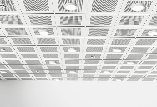 Suspended ceiling with lighting fixtures and smoke detectors.