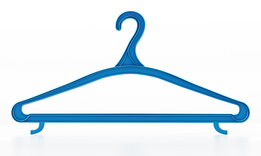 Pink plastic and green plastic clothes hanger on white background