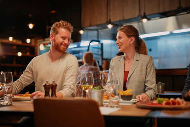 istock Friends having dinner at restaurant. 1185664931