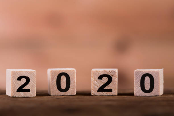 istock New year 2020 on wooden cubes on table with copy space for text 1185666296