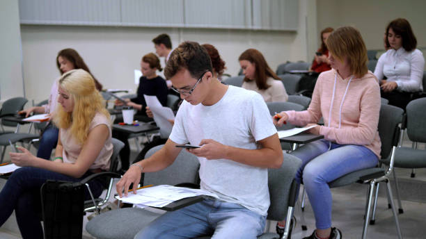 istock Students turn in their papers in university 1185666459