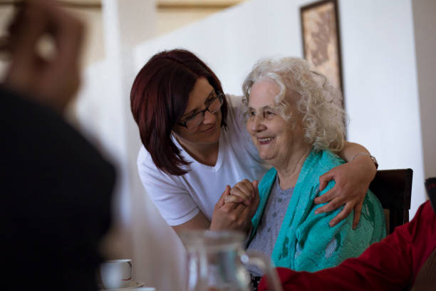 Taking care of seniors in nursing home stock photo