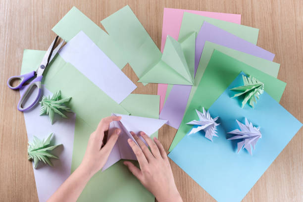 In the process of making Christmas trees, origami. stock photo