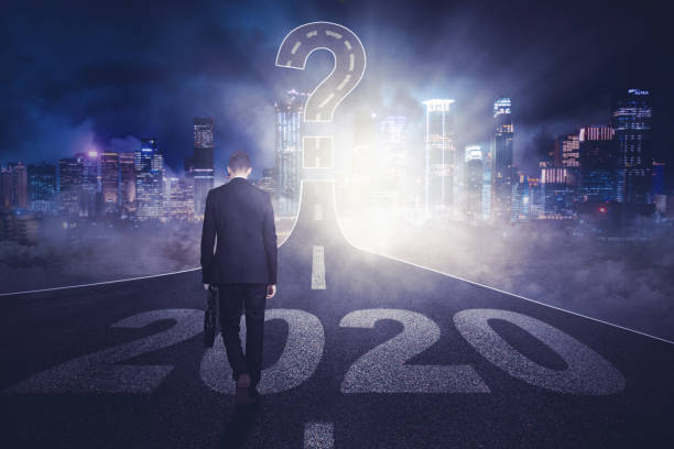 istock Businessman with number 2020 and question mark 1185668286