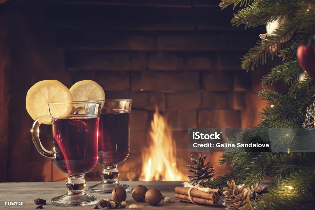 https://media.istockphoto.com/id/1185671125/photo/two-glasses-of-mulled-wine-on-a-wooden-table-near-a-christmas-tree-in-front-of-a-burning.jpg?s=1024x1024&w=is&k=20&c=KtiTt3Ozilm0Ig2S40Dkngn4afSnsbGIZNStkY-zo58=