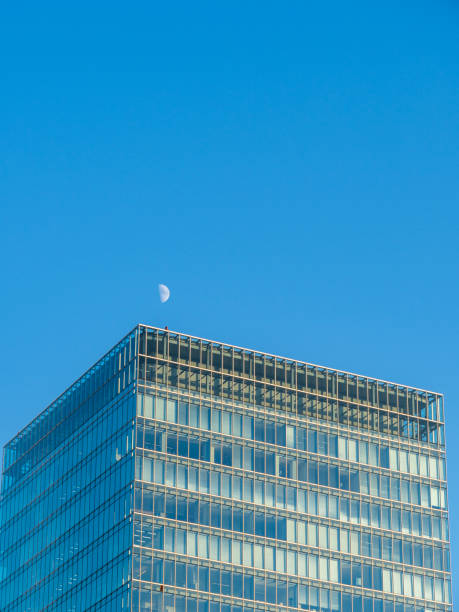 istock skyscrapers near Tokyo station with half moon. 1185671484