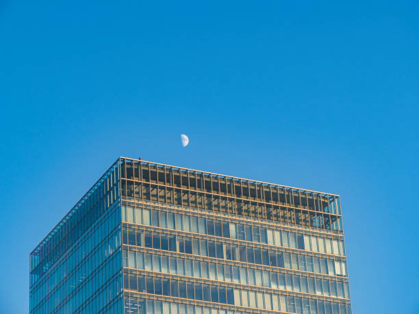istock skyscrapers near Tokyo station with half moon. 1185671497