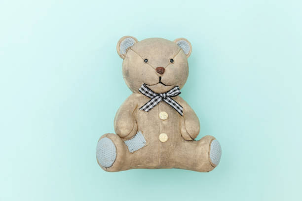 istock Toy bear isolated on pastel blue background 1185671512