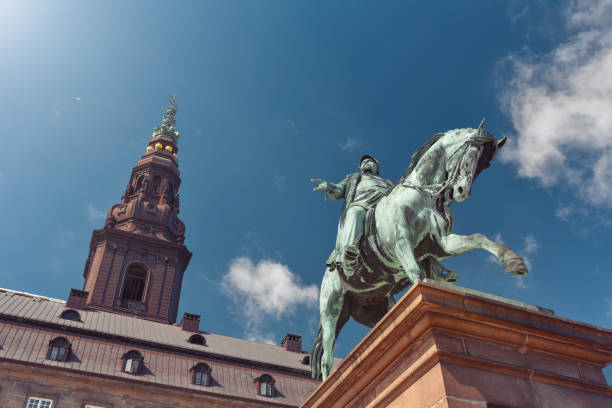Equestrian statue of Frederick VII on background of Christiansborg palace (parliament of Denmark)