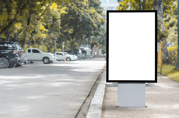 istock led blank billboard white screen side road in city. ad mockup copy space for advertising banner near bus stop in metropolis. 1185673785