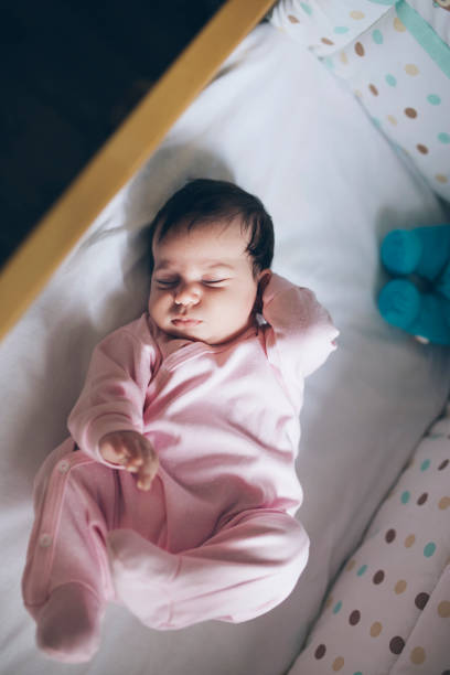 Cute baby girl sleeping in crib