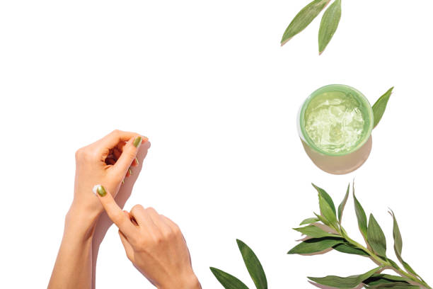 istock View from above woman's hands applying cosmetic cream 1185674951