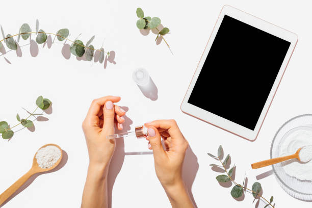 istock Woman's hands applying cosmetic serum 1185675022