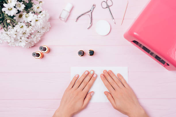 istock Top view of female hands with manicure 1185675135