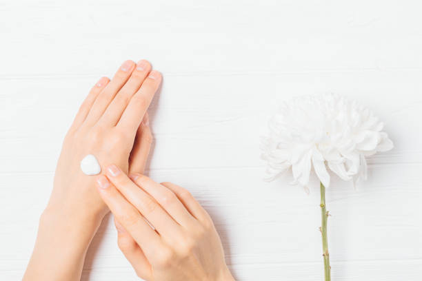 istock Woman's hands applying nourishing lotion 1185675171