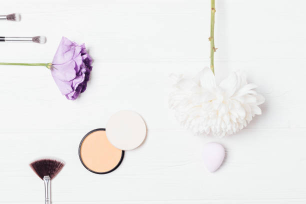 istock Flat lay frame makeup products and fresh flowers 1185675200