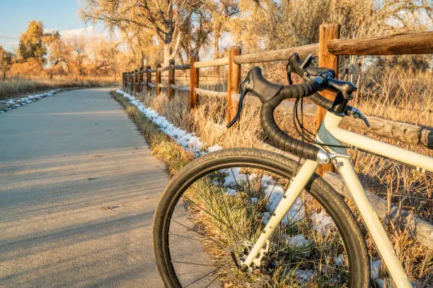 touring bicycle on a bike trail in late fall scenery - Poudre River Trail in northern Colorado