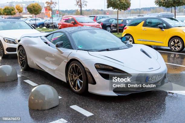 White Mclaren 720s In The Parking Lot Under Rain Stock Photo - Download Image Now - McLaren Automotive, Car, Casual Clothing