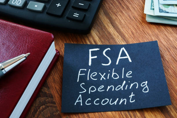 istock Text sign showing hand written words FSA flexible spending account 1185676843
